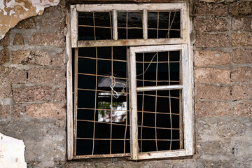 Fototapeta na wymiar Window in an old Soviet abandoned building
