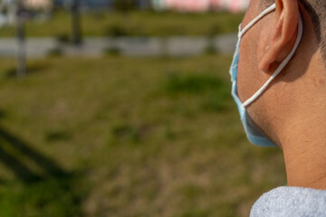 Latin American man with mask in the park - Man with a back with a mask by the corovanirus - Covid 19
