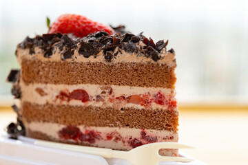 side view chocolate flavor cake with strawberry close up horizontal composition