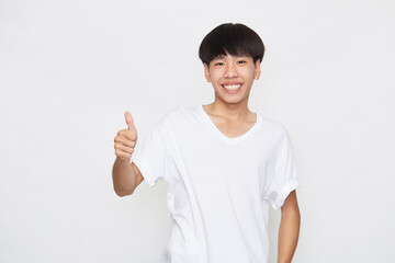 Asian young man going thumb up