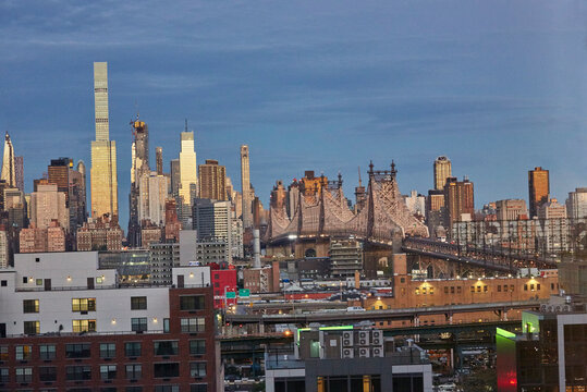 Manhattan sunrise with city skyline lit up view from Long Island City in Queens NY