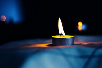 Candles burning over the Star of David in memory of the dead.