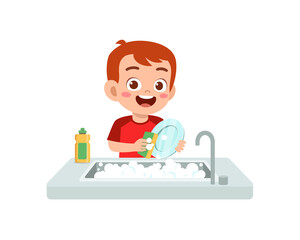 happy cute little boy washing dish in the kitchen