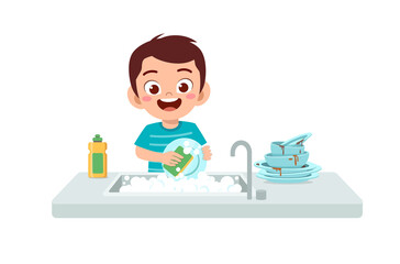 happy cute little boy washing dish in the kitchen