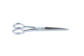 Obraz premium Silver metal scissors for haircut on white background.