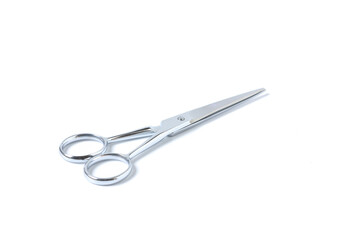 Silver metal scissors for haircut on white background.
