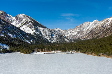Obraz premium Aerial view of Twin Lakes California covered with snow and ice during winter.