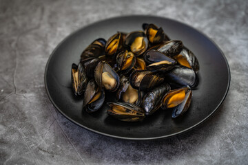 The mussel in the sink is ready to be cooked.	