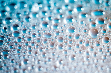 drops on glass blue background