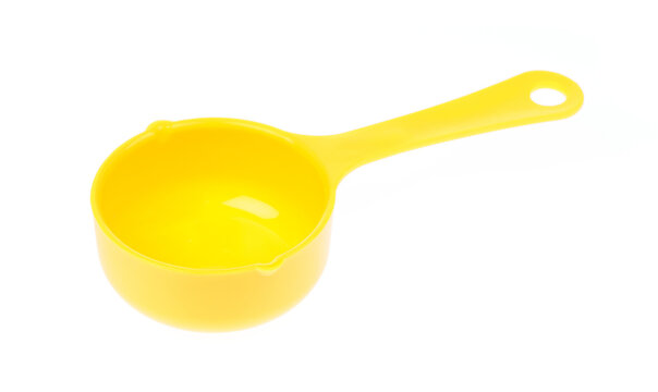 Yellow plastic scoop isolated on white background