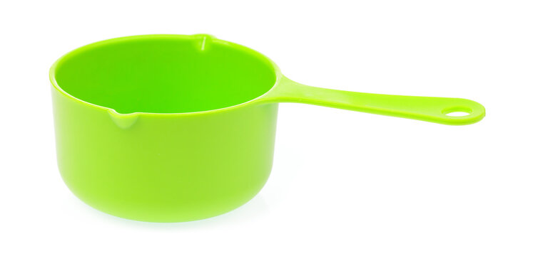 Green plastic scoop isolated on white background