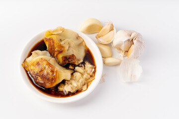 Featured Chinese fried dumplings on a pure white background
