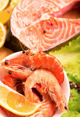 Fresh salmon steak filet, ginger, lemon, soy sause and chopsticks