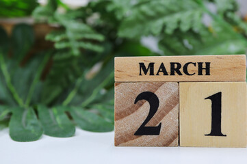 Day 21 of March month, Wooden calendar with date on the table.