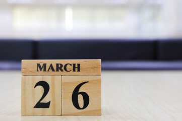Day 26 of March month, Wooden calendar with date on the table.