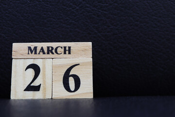 Day 26 of March month, Wooden calendar with date on the table.