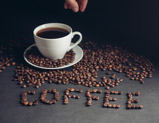 a cup of coffee for breakfast and the inscription arabica drink on the table