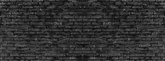Old vintage retro style black bricks wall for brick background and texture.	