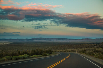 dramatic empty and lonely back road in the California desert.