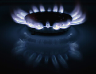  Natural gas burning a blue flames on black background