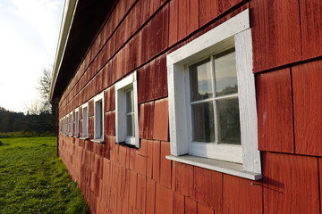 Close-up the Red Barn Farm siding with windows.