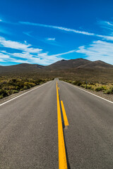 dramatic empty and lonely back road in the California desert.