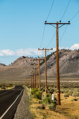 open empty desert road in eastern California near the Sierra Nevada mountains.