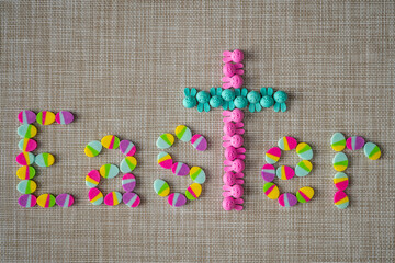 Colorful Vibrant Easter Spelled out in Eggs Christian Cross and Bunnies