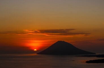 Naklejka na ściany i meble Sunset with Manado Tua Island (Manado, North Sulawesi, Indonesia)