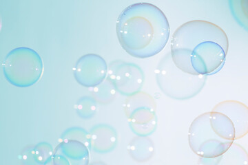 Beautiful transparent colorful soap bubbles float background. 