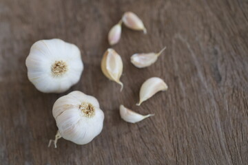 Onion and garlic for cooking on old wooden background