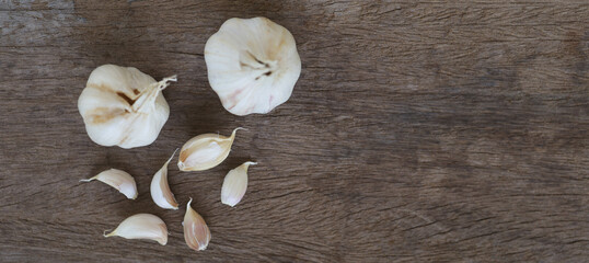 Onion and garlic for cooking on old wooden background