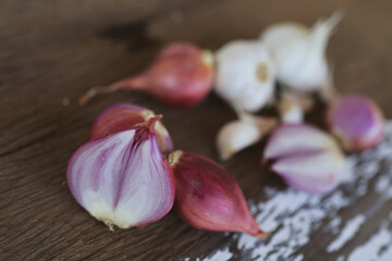 Onion and garlic for cooking on old wooden background