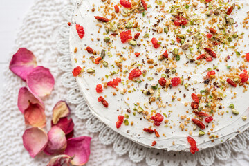 white cream cheese mascarpone cake yogurt cheesecake  with pistachios raspberries  goji sprinkle topping 