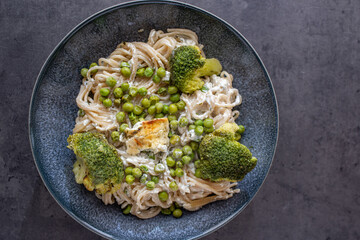 healthy baked green spaghetti pasta with feta cheese