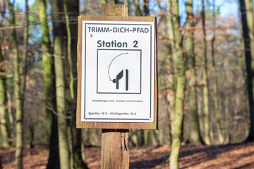 German sign on a fitness trail in the forest