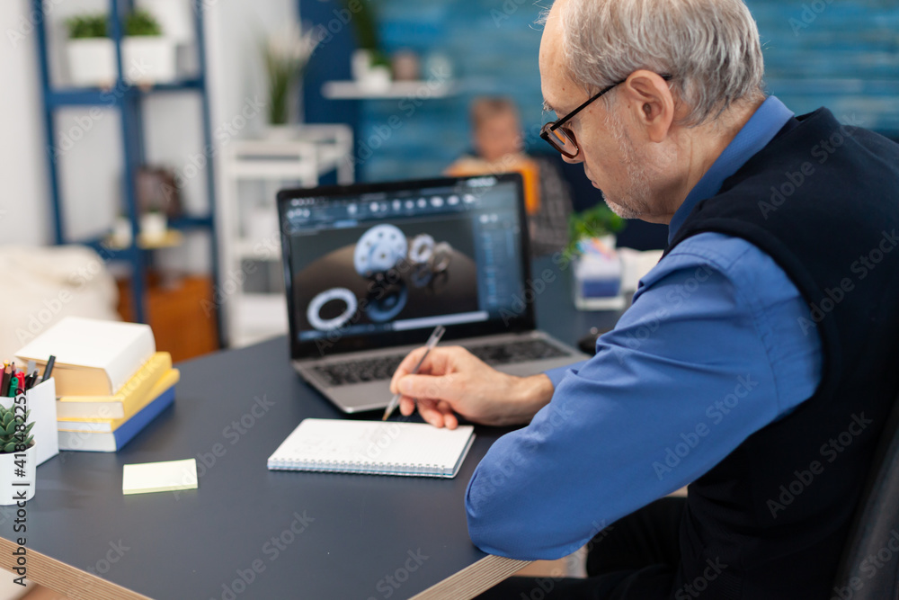Poster smart thoughtful technician writing on notebook. experienced engineer working from home office on me