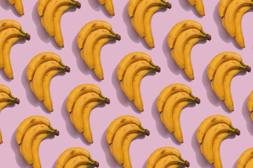 Bundh of bananas pattern on pink background, flat lay style minimal