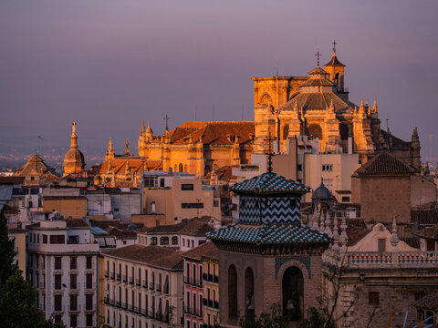 cathedral of granada bathed in golden sunlight at sunset in the old town of granada, spain