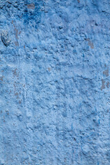 texture of a blue wall covered with volumetric plaster, space for text, space for copy