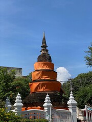 temple stupa draped in orange cloth