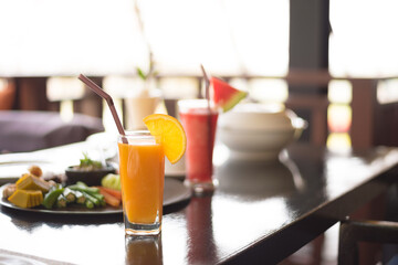 Orange juice on the table, selective focus