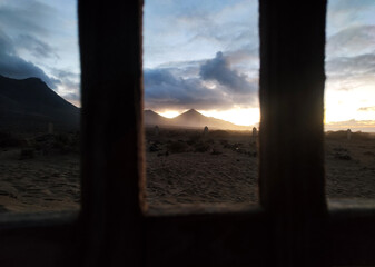 Views of the volcanic mountains from the abandoned church of cofete beach. Fuerteventura, Canary island.