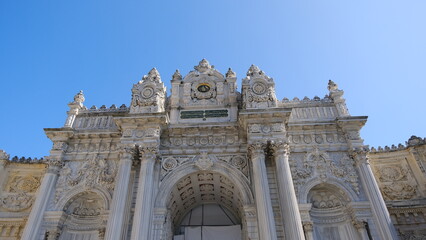 Fototapeta na wymiar Turkey istanbul 04.03.2021. Entrance and magnificent gate of Dolmabahce palace established during ottoman empire time by barque architecture great details.