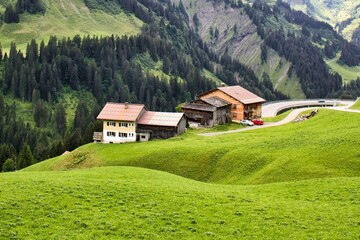 cultivated alps in a gently rolling landscape in the allg&auml;u alps, germany