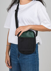 Woman carry the casual bag on shoulder with active and easy gesture