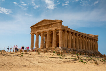Fototapeta premium View of the Valle dei Templi near Agrigento in Sicily. A sunny morning with beautiful light emphasizes the charms of Greek ruins.