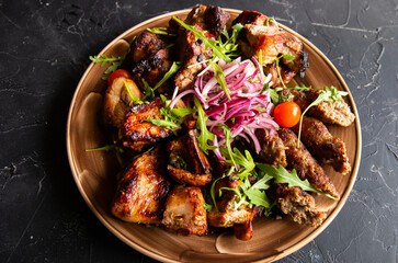 Assortment of different dishes on a plate, grilled meat, barbecue party - shish kebab, lula kebab