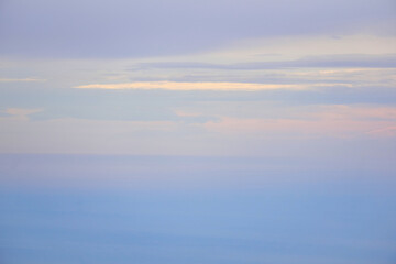 Fototapeta na wymiar seascape - the sea merges with the sky in the dawn fog