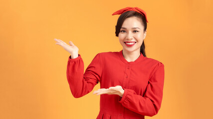 Smiling young woman with straight hair in ponytail